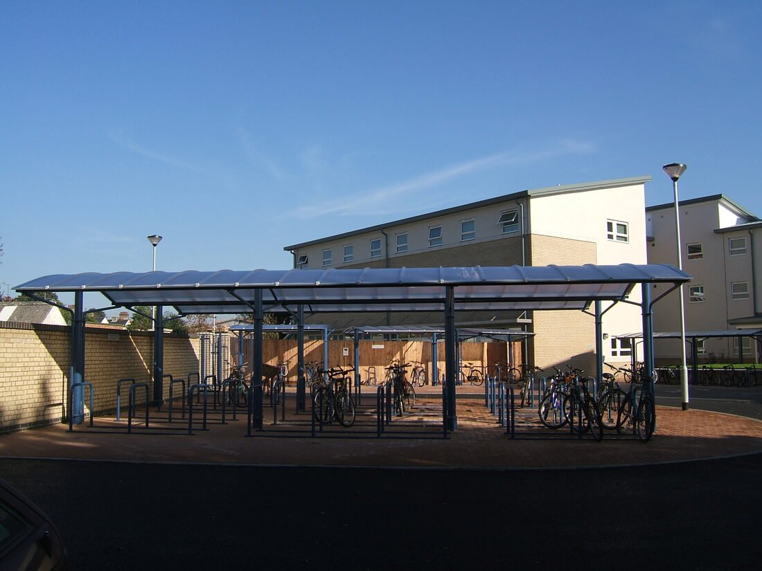 Sedley Court building exterior with bike shelters in front